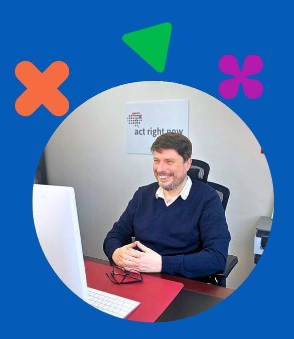 Photo of Dr Gabe at his desk doing an online session with a client